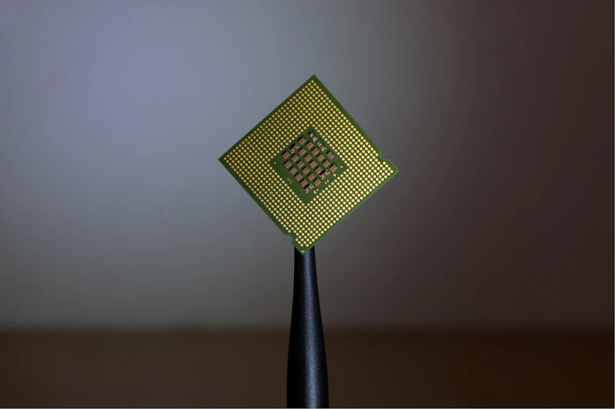 Packaged processor held by tweezers