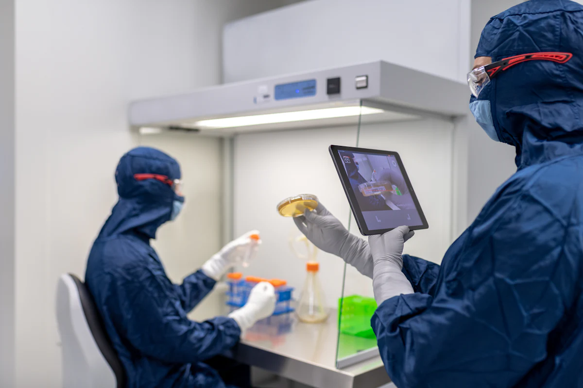 Laboratory staff in blue lab coats